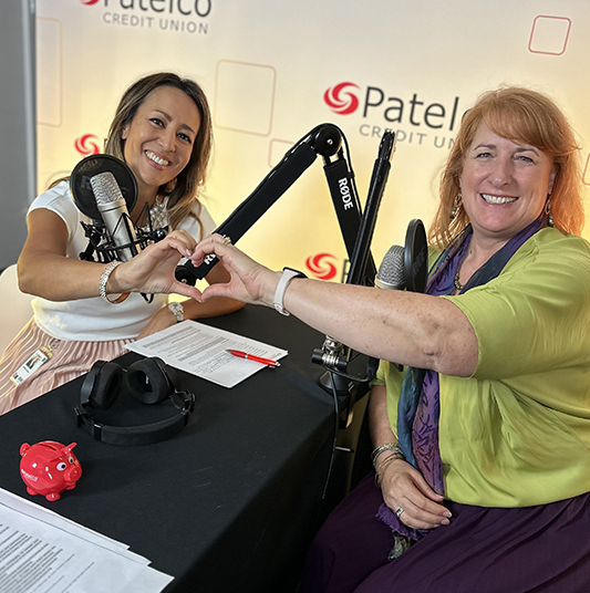 Patelco Employees Michele Enriquez and Cara Houck at the podcast desk.